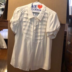 White button up blouse, light stain on right arm